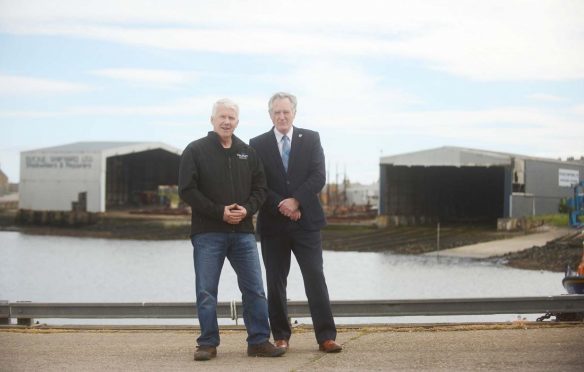 Macduff Shipyards managing director John Watt and Moray Council's economic development committee chairman John Cowe in front of the newly-purchased shipyard.