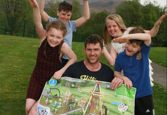 Damian MacDonald with Daisy MacDonald, Ewan MacDonald, Faith Easson and Zander MacDonald celebrate the news of a new playing field in Caol.