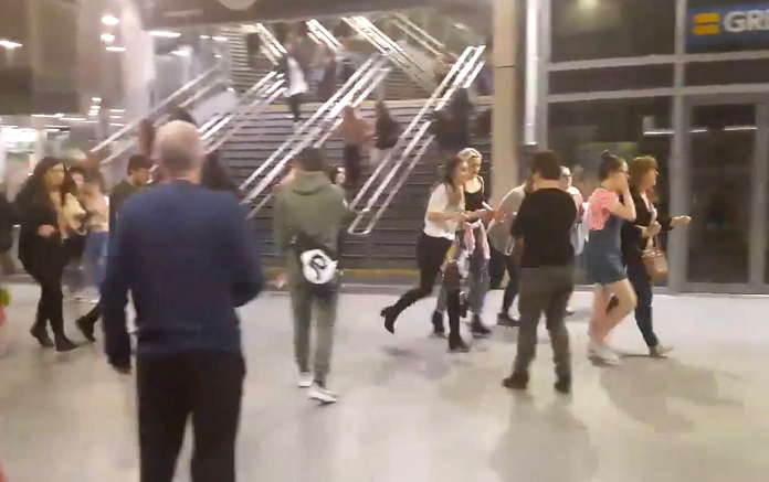 People running through Manchester Victoria  station after an explosion at Manchester Arena @Zach_bruce/PA Wire