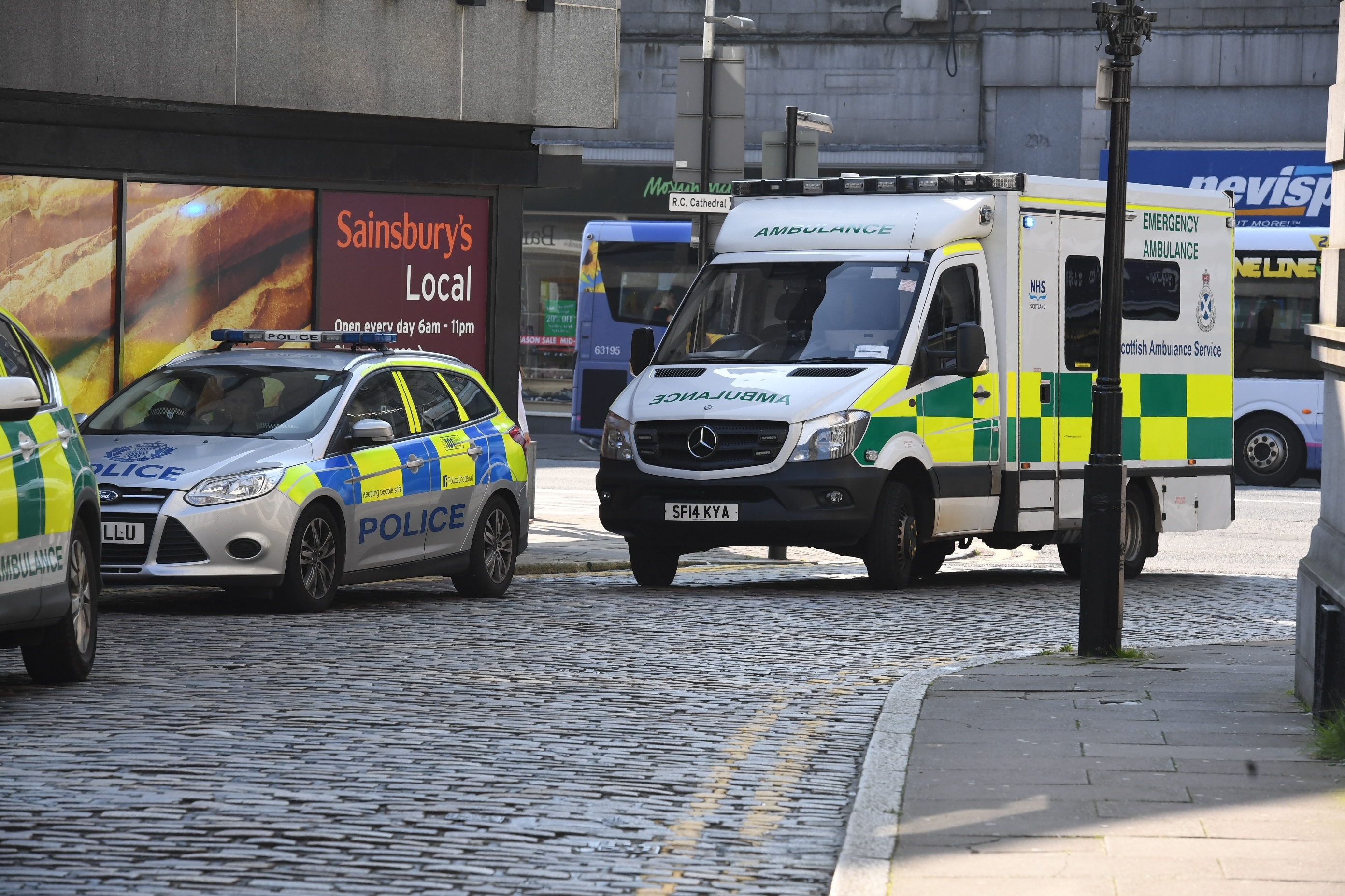 Police attend the scene near Union Street and Huntly Street in Aberdeen.