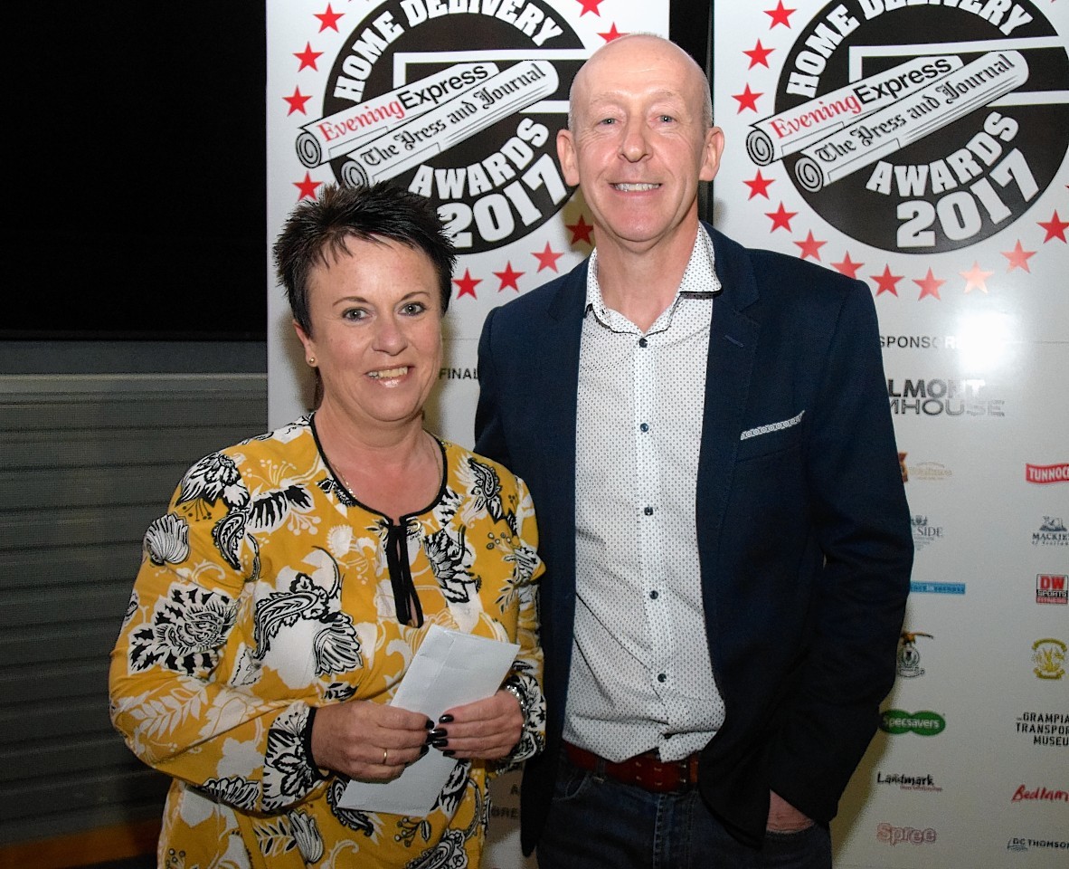 winner Lesley Wilson with Neil Mackland, Head of Newspaper Sales.