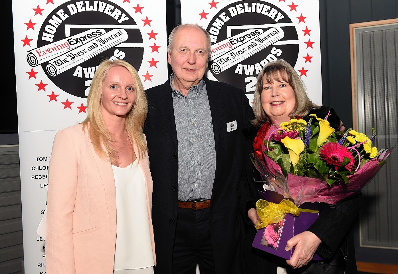 Clair Ogilvie, HND Manager at the Evening Express with winners Dennis and wife Yvonne Benzie. (mannofield).
