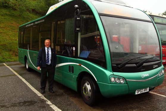 Russell Dodds Area Manager West Coast Motors show off the bus being trialed by the company which carries batteries  on the roof and in the boot of the bus picture kevin mcglynn