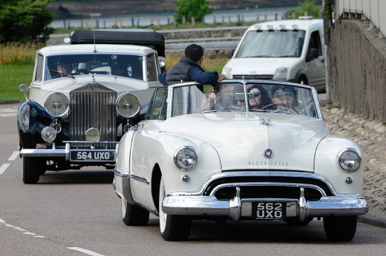 A convoy of vintage cars leaves for Invernlochy Castle Hotel