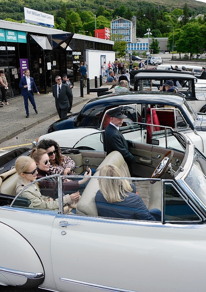 Visitors take their seats in vintage cars in Fort William