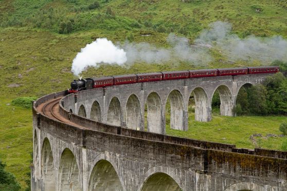 The Jacobite steam train passing over the Glenfinnan Viaduct at the head of Loch Shiel, Lochaber, Highlands of Scotland
Picture Credit : Paul Tomkins / VisitScotland