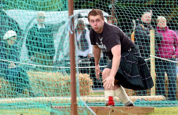 James Dawkins from Aboyne competes in the light hammer event.