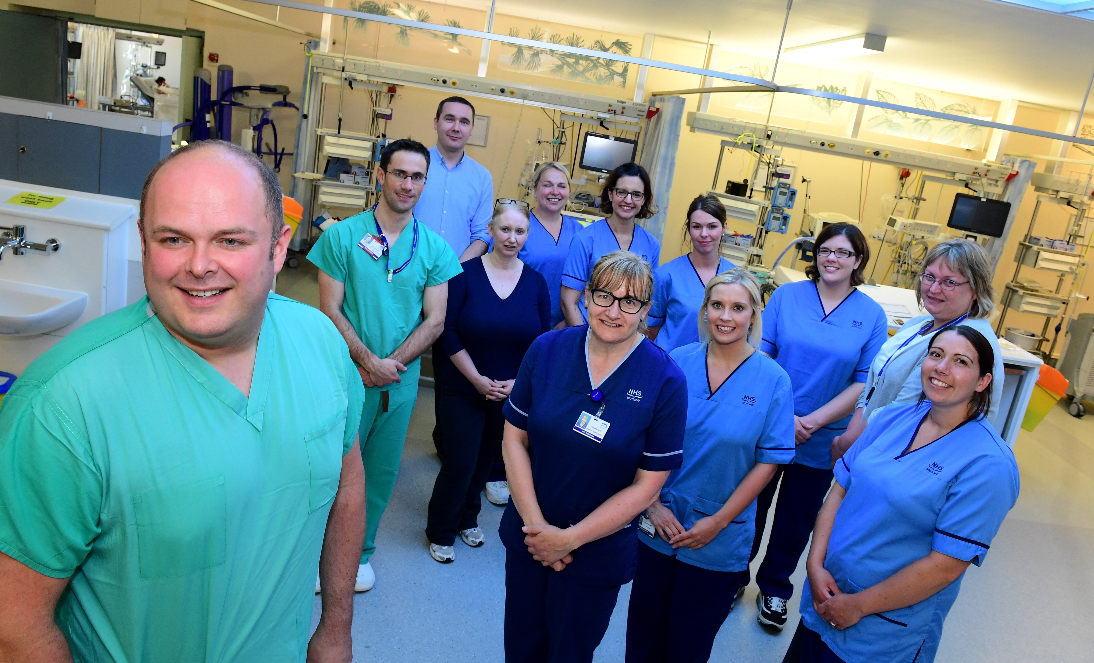 The Intensive Care Unit at Aberdeen Royal Infirmary. Pictured - Dr Ian Macleod (front) with the doctors and nurses in ICU.
Picture by Kami Thomson