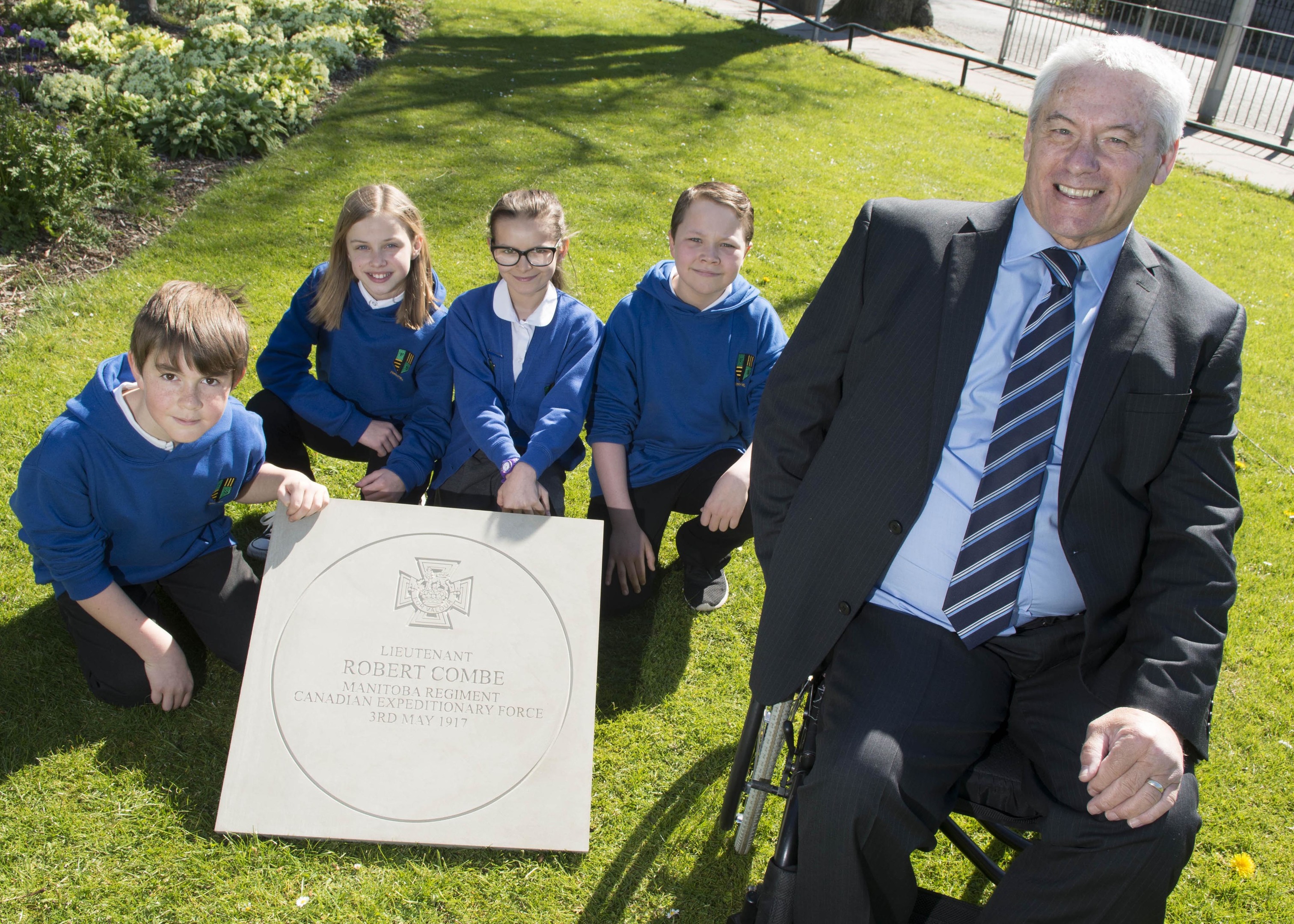 03/05/17 Vice Lord Lieutenant Andrew Lawtie with Ferryhill Primary School House captains- pupils L-R Matthew Wheeler, Bryony Anderson, Alexane Wood, and Kieran Thomson, all 11YO pr7

A commemorative stone was laid in Aberdeen today (Wednesday 3 May) to mark the centenary of the death of First World War Victoria Cross recipient Robert Grierson Combe.Born on Holburn Road, Aberdeen in 1880, Robert Combe attended Ferryhill School and Aberdeen Grammar School before taking up an apprenticeship as a pharmacist.  He emigrated to Canada in 1906 where he opened his own pharmacy business in Melville, Saskatchewan before enlisting in the Canadian Expeditionary Force.