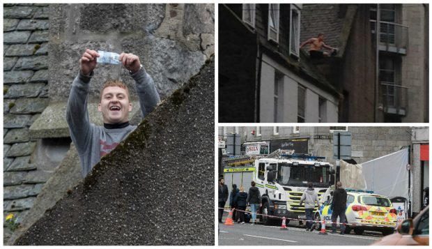 The man has been on top of the roof in Aberdeen city centre for hours