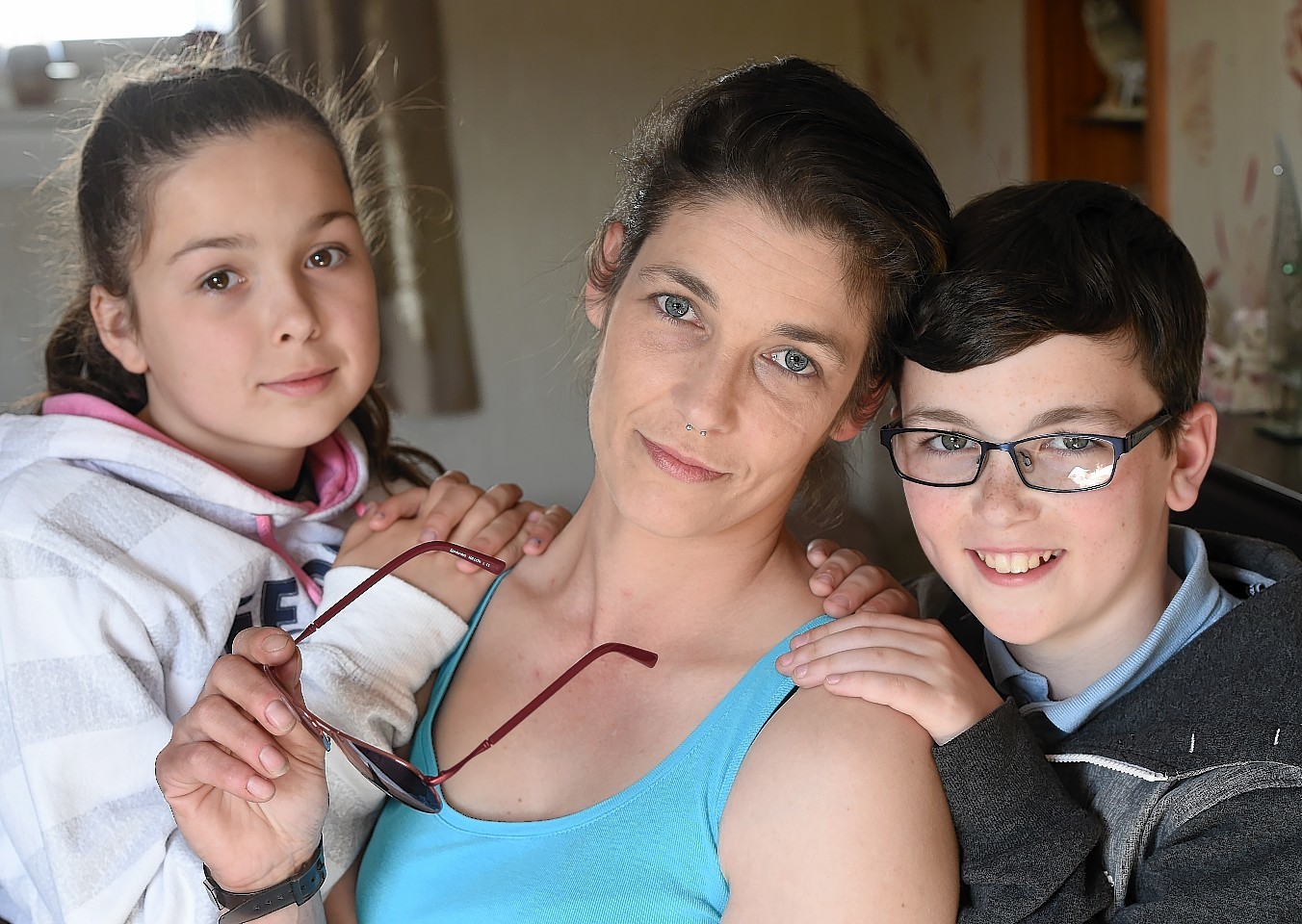 Marlene Logie of Dingwall who suffers from Lime Disease photographed with her daughter Reece (12) and son Finlay (10). Pic by Sandy McCook.