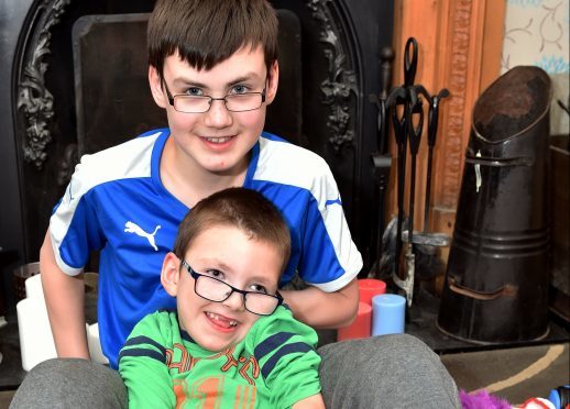 Seven-year-old Aiden Matheson with his older brother James, 13. Pictures by Colin Rennie.