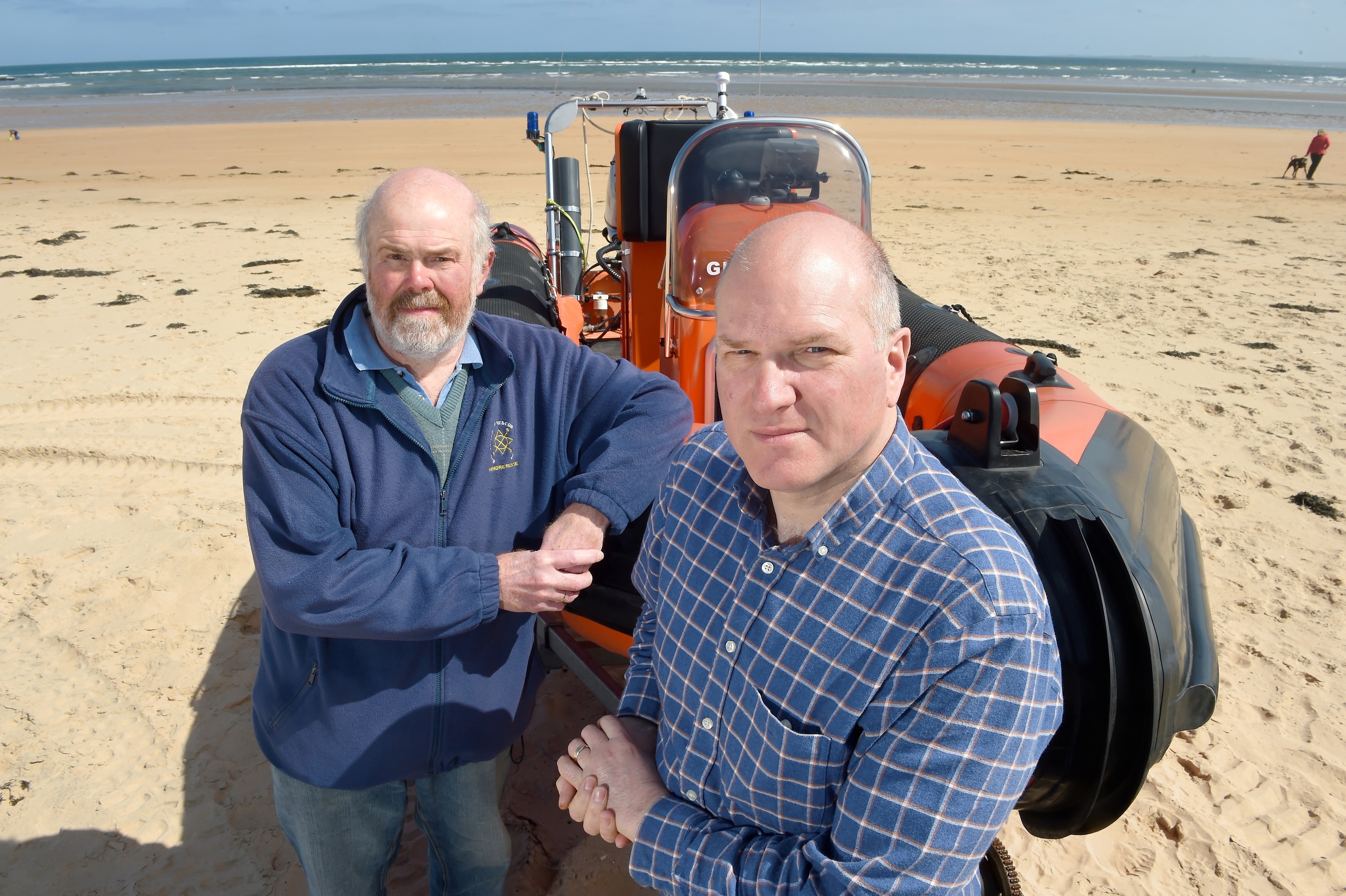 Photographed with their lifeboat on Dornoch Beach are Neil Dalton (left) Chairman of the Association and on the right Antony Hope, a crew member. Pic by Sandy McCook