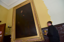 John Barclay of firm Corporate Moves begins removing a portrait of Sir Alexander Baillie from the Town House.