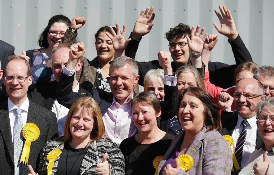 Scottish Liberal Democrat leader, Willie Rennie, celebrates with newly elected councilors at Meadowbank Stadium, Edinburgh.