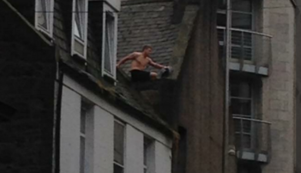 The man has been on top of the roof in Aberdeen city centre for hours