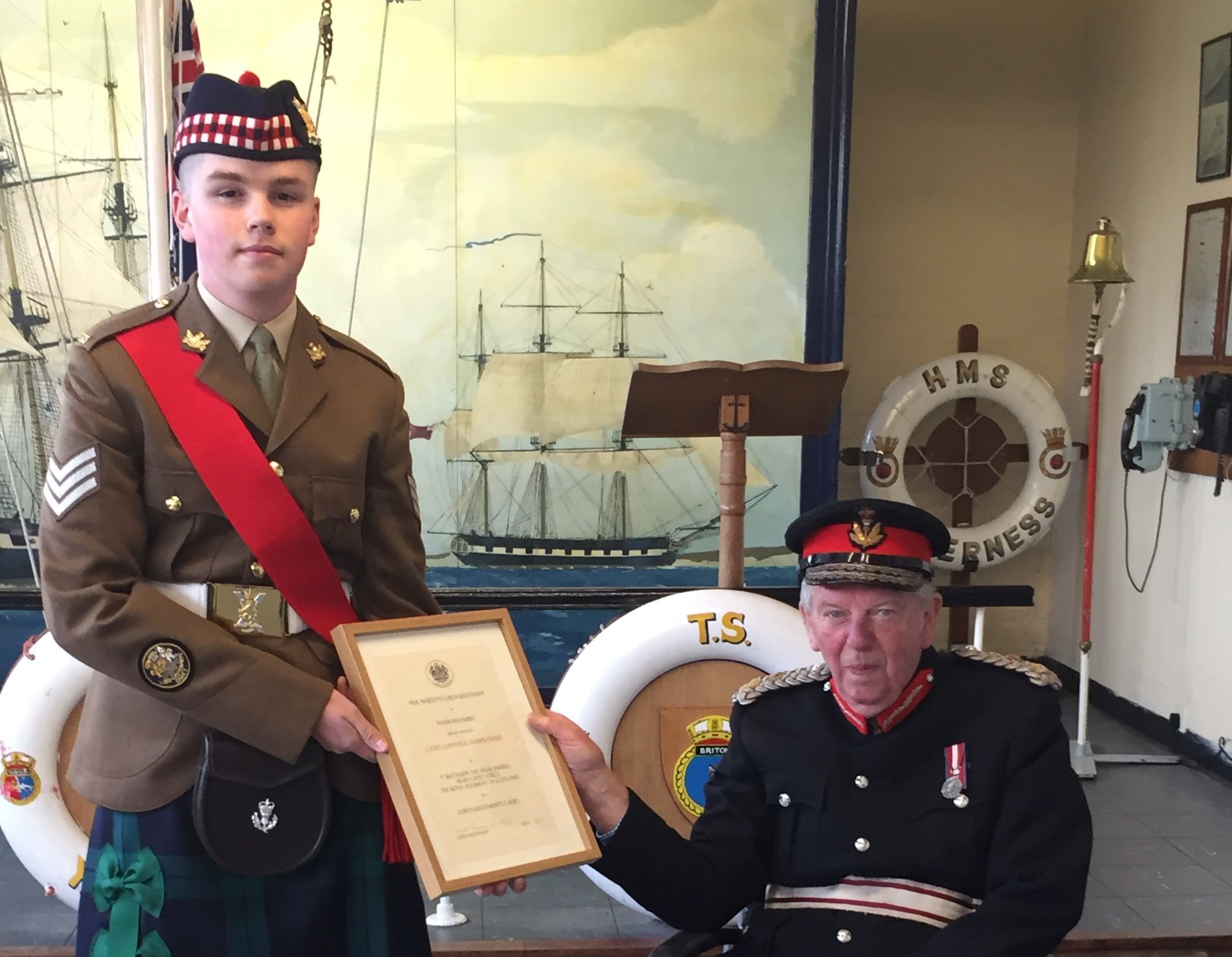 Sergeant Shawn Feeney receiving his Lord Lieutenant's Cadet Certificate from Donald Cameron of Lochiel the Lord Lieutenant of Inverness