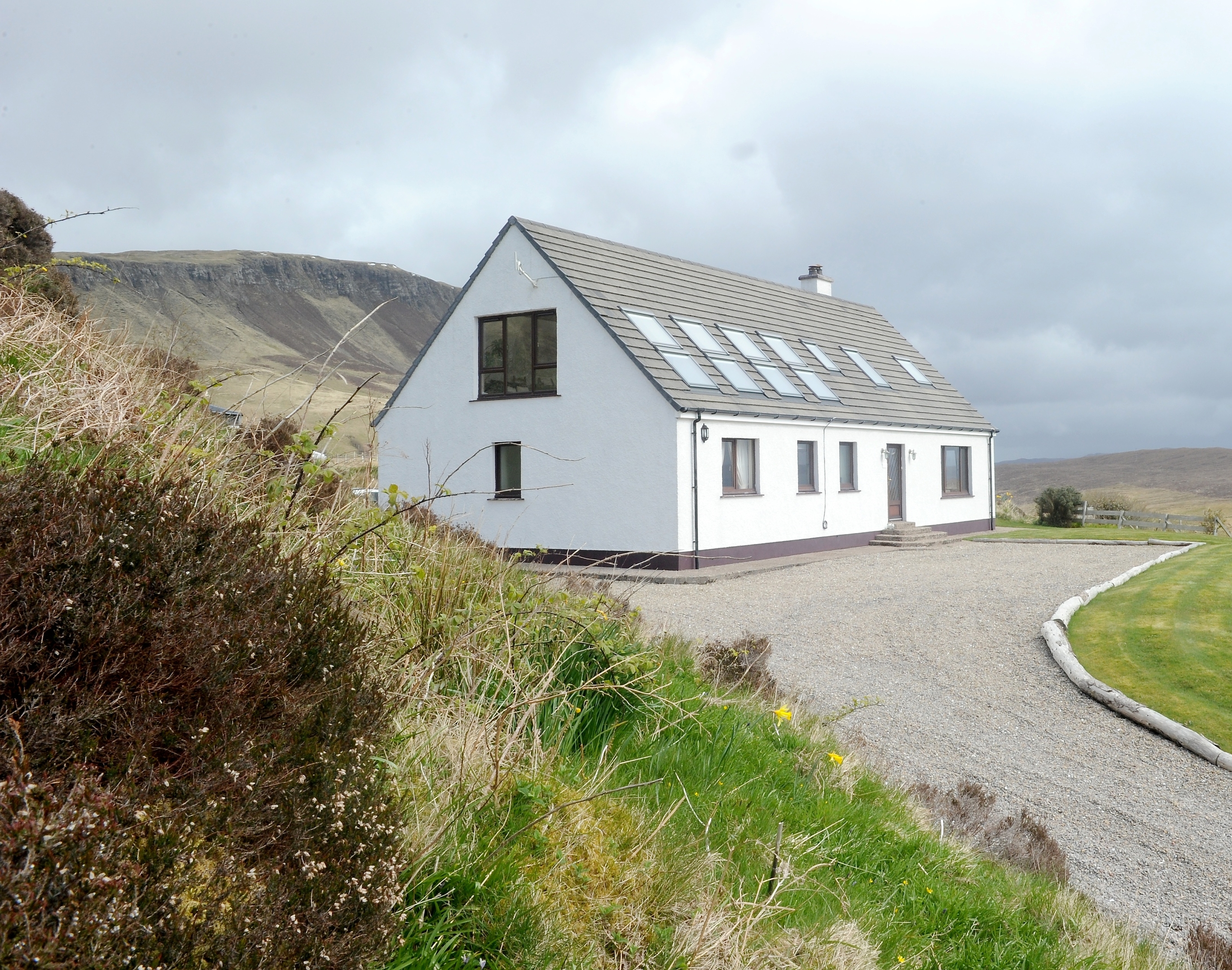 Picture by SANDY McCOOK  27th April '17 Your Home. Mary and Drew Sim of Mary's Thatched Cottages, Elgol, Skye which is for sale and includes their own house plus four thatched self catering cottages.