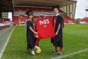 Aberdeen University students Beiqiao Gu, left, and Weipeng Liu show off their Dons’ colours