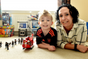 Alex Crichton, 7, suffered a stroke when he was a baby which resulted in brain complications. He is pictured with his mum Julie. He has recently had support from Child Brain Injury Trust.