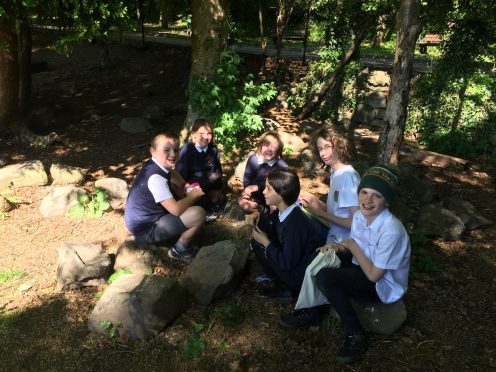 Banchory primary School pupils test-run the new game 'Bug Off'. (L-R) Jack Marhshall, Abby Broughton, Evan Crichton, Victoria Placzkiewicz, with creator Tom Hall and illustrator Cailean Annand-Hosie.