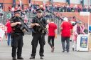 Armed police stand guard outside Hampden