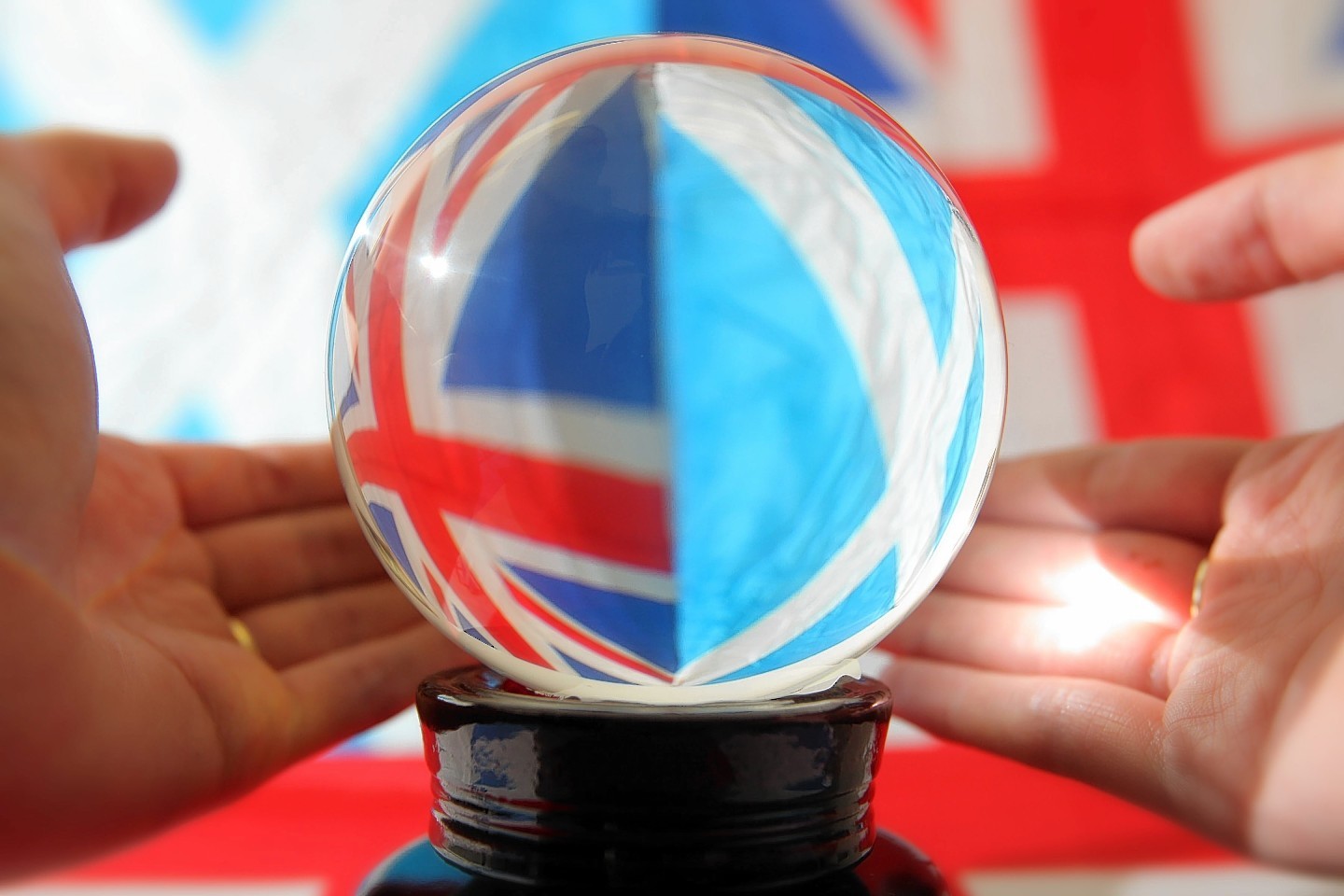 A Union flag and the Scottish Saltire viewed through a crystal ball the day before the people of Scotland cast their votes in the Scottish Independence Referendum. Sept 17th 2014