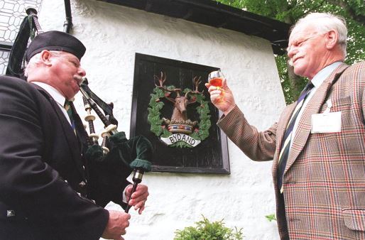 John Dow (right) raising a dram towards the Gordon 2000 cultural event outside the Gordon Highlanders Museum.