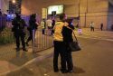 Armed police (left) at Manchester Arena after reports of an explosion at the venue during an Ariana Grande gig