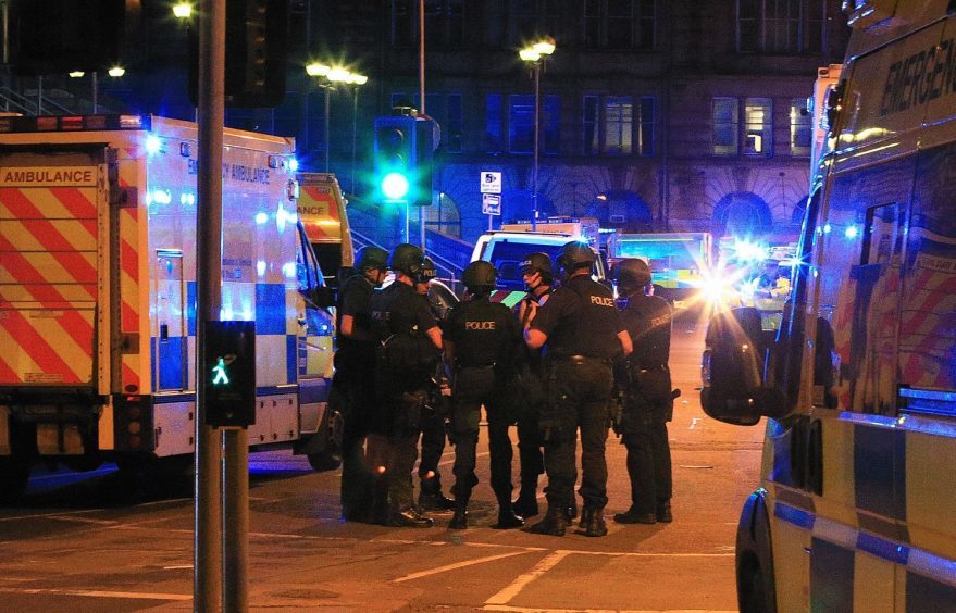 Armed police at Manchester Arena after reports of an explosion at the venue during an Ariana Grande gig