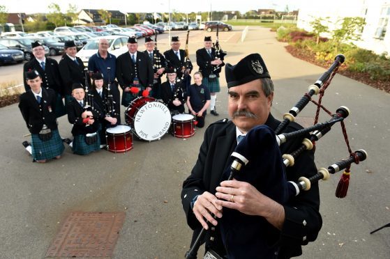 Domhnull Mclennan and some of the pipe band. Picture by Kenny Elrick.