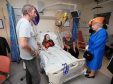 Queen Elizabeth II speaks to Millie Robson, 15, from Co Durham, and her mother, Marie and Father David during a visit to the Royal Manchester Children's Hospita