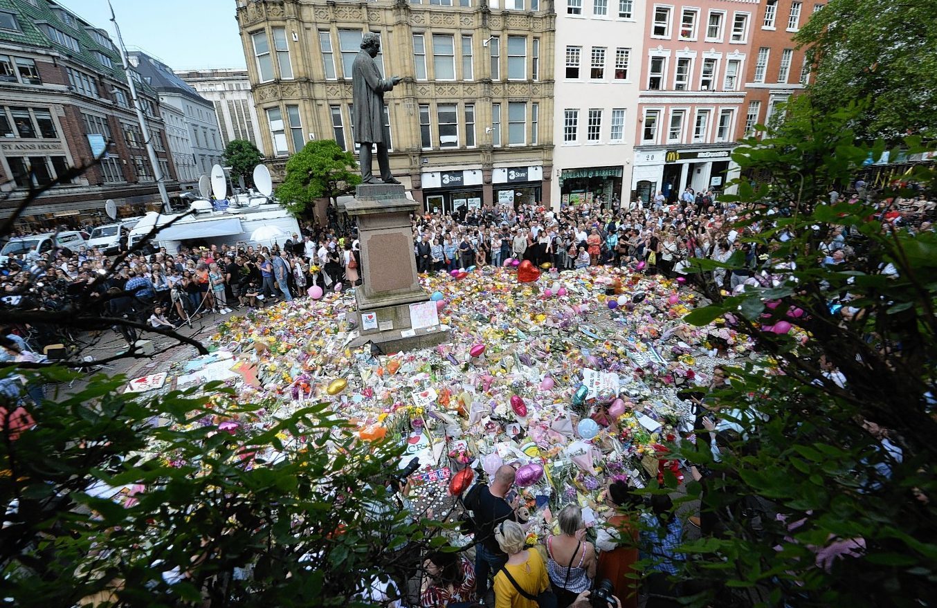 Tributes to those killed and injured laid in St Ann's Square, Manchester