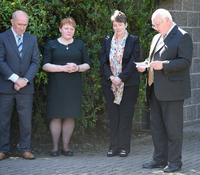 Councillor Bill Lobban leads the minutes silence at Highland Council headquarters in Inverness. Pic by Sandy McCook