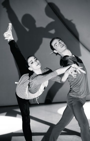 Principle dancers Sophie Martin and Christopher Harrison warming up for the show on the stage at HMT.