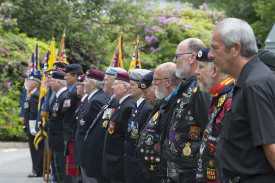 Veterans look on as Lord Provost Bill Howatson raises the Armed Forces Day flag at Aberdeenshire Council's HQ in Aberdeen  in 2017