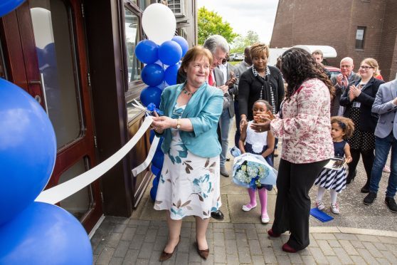 Maureen Watt MSP cutting the ribbon for the opening of the Asthma Allergy Support Centre