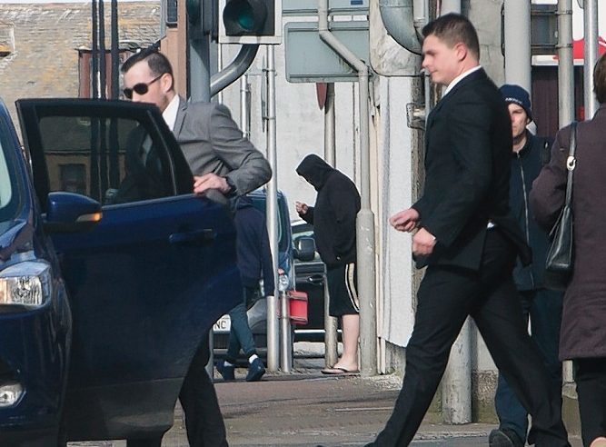 Pictured: Darren Guild (black suit) and Martin Coyle (grey suit and sunglasses)