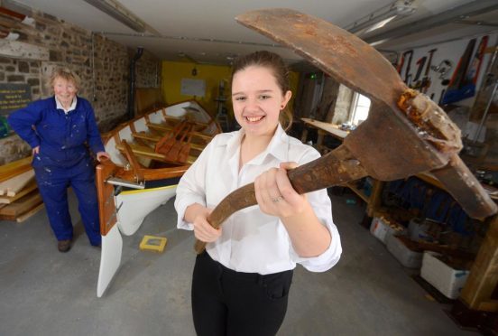 Willow Daymond is one of the teenagers learning to build boats at Cullen Sea School. Also pictured: Rosie Pye, sea school secretary.