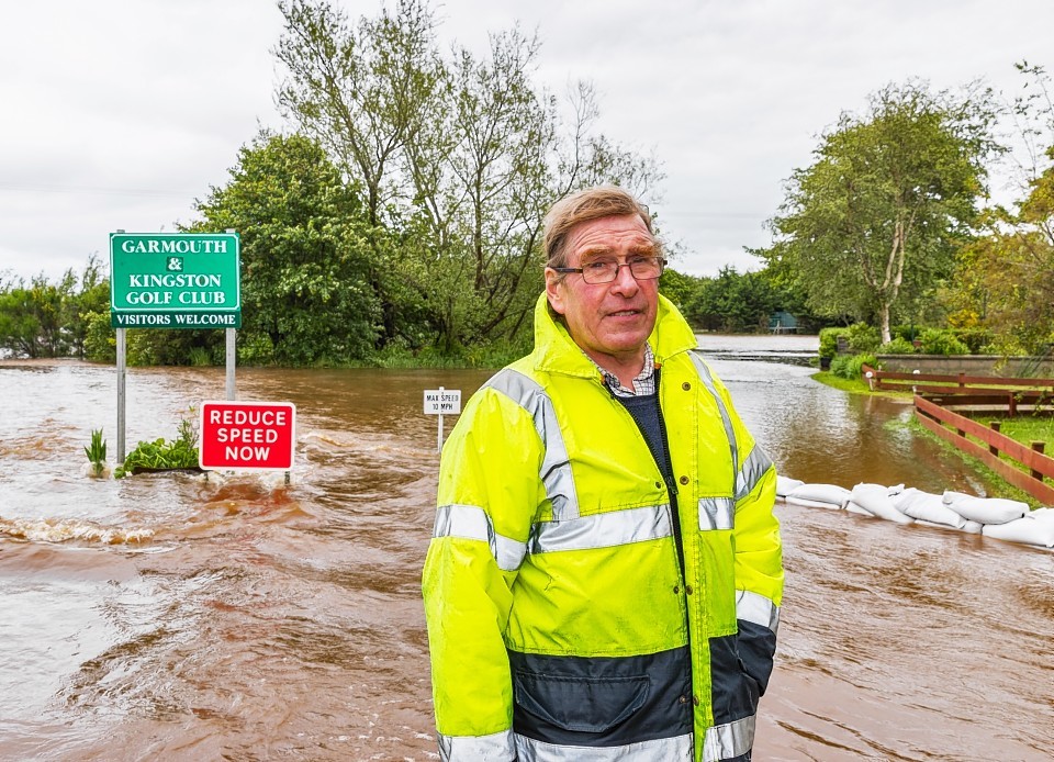 David Mackay at the flooding in Garmouth next to his home