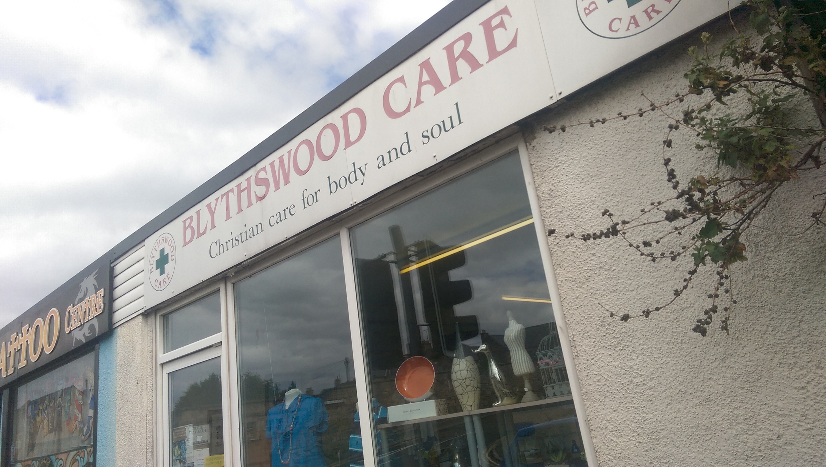 A charity tin containing about £20 was stolen during a break-in at Blythswood Care charity shop.