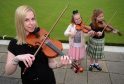 Fiddle instructor Barbara Anderson with pupils Jane Seivwright, left, and Kathryn Brown, right.