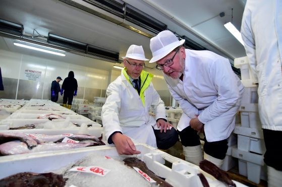 Peterhead Harbour CEO Ian Laidlaw with Scottish Secretary David Mundell at Peterhead fish market in June 2017.