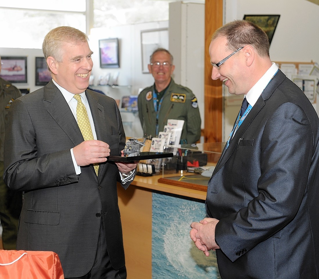 The Duke admires a model replicating the aircraft he flew during the Falklands conflict 35 years ago