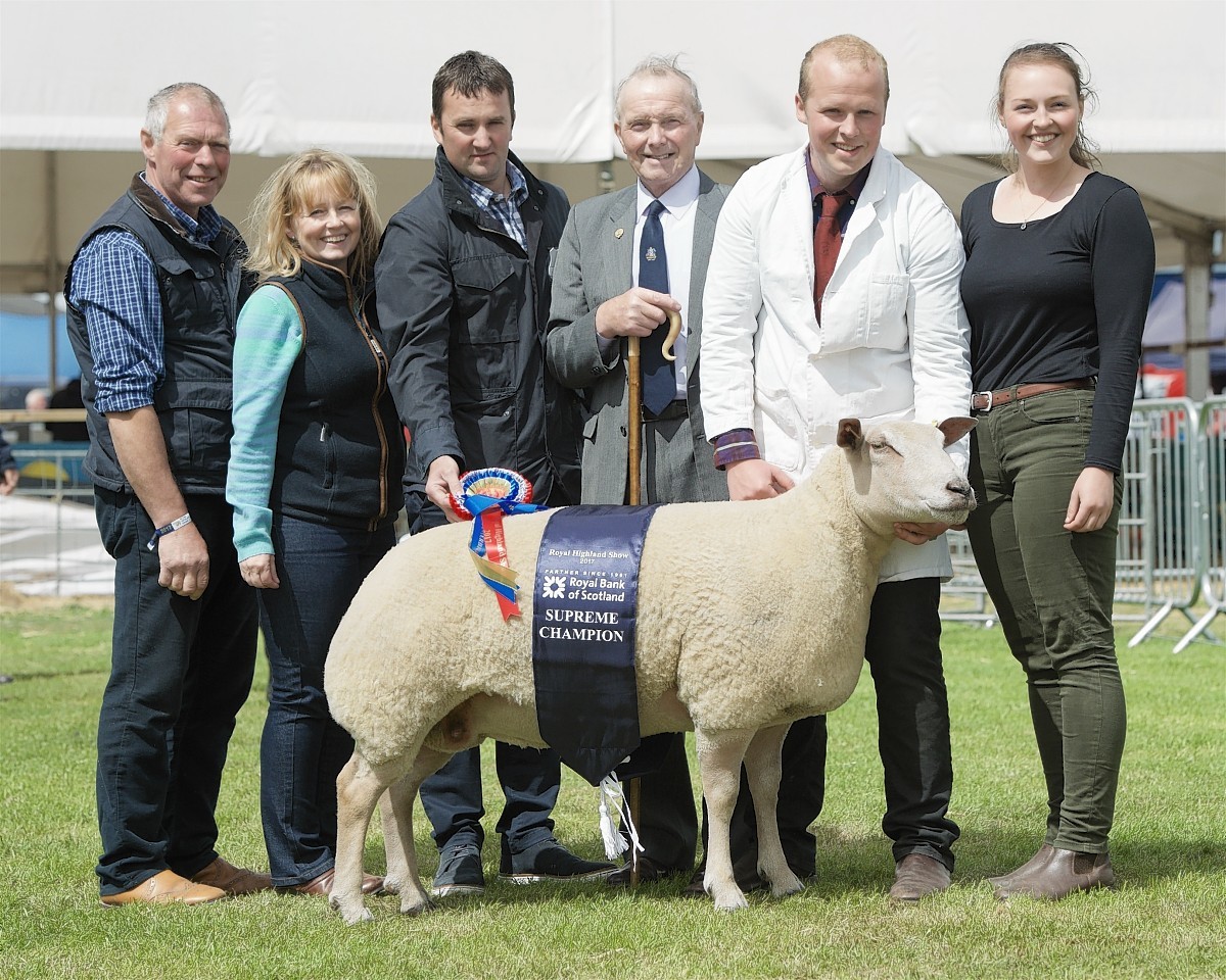 Members of the Ingram family being presented their award by the judge and one of the show's many sponsors.