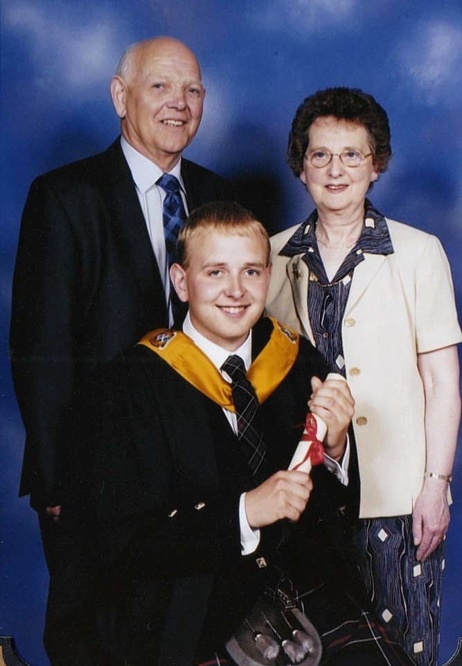Sandy Ingram, left, with wife Ann and son Andrew at his graduation. 