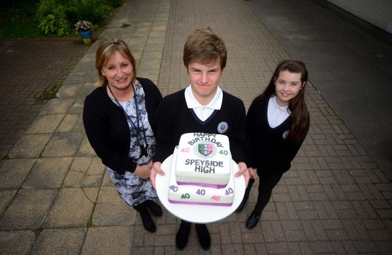 Speyside High celebrated its 40th birthday with a series of fun events for the kids and community. Pictured: Patricia Goodbrand, head teacher, George Sansom, 14, and Leonna Squibb, 12.