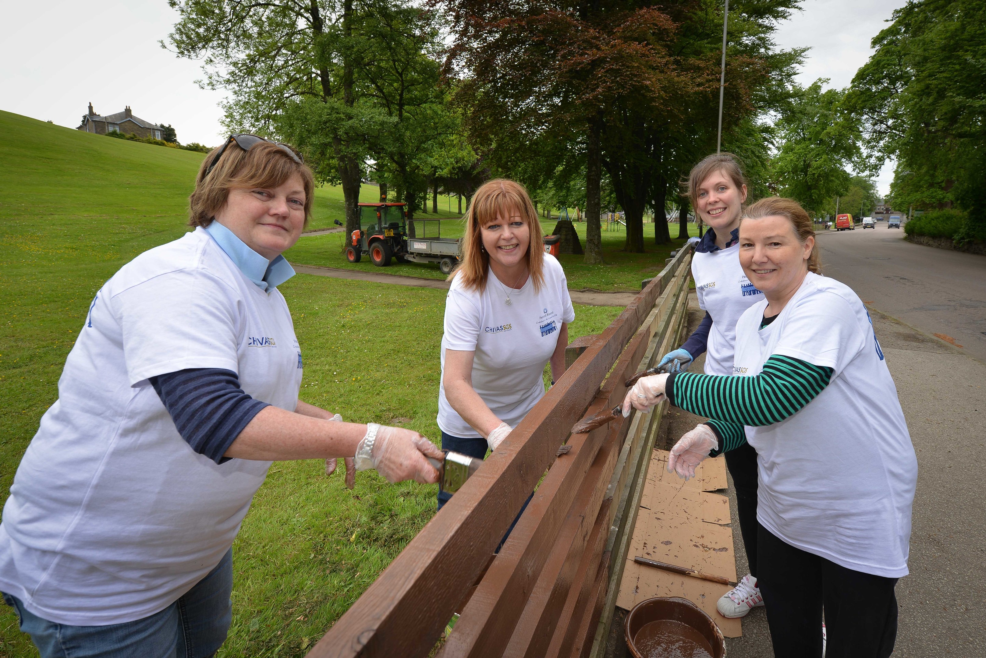 Chivas Brothers staff Linda Brown, Caroline Mitchell, Ashley Brown, Yvonne Thackeray got to work painting a new fence.