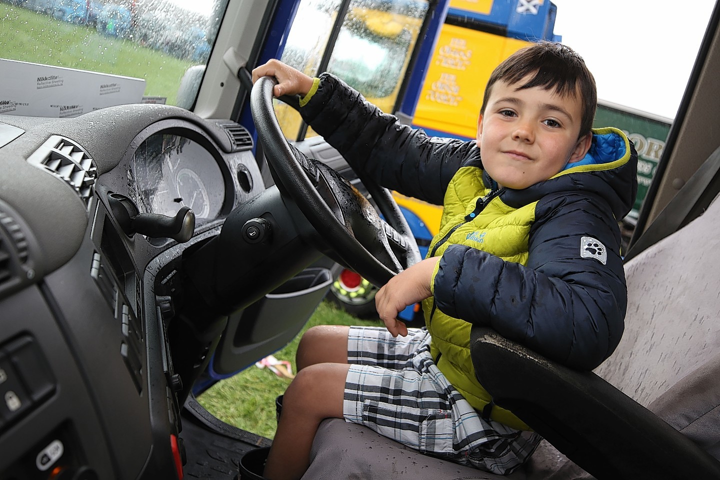 Truck-loving Daniel Frain, 7, from North Kessock gets to grips with one of the showpiece vehicles.