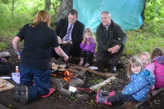 The Scottish Government Minister for Childcare and Early Years, Mark McDonald MSP and Richard Lochhead MSP visit Earthtime Nursery on Duffus Estate it is a nursery based on out side learning.

also in the photo little Orlaith Kessack 3 (centre)

Photo by
Michael Traill						
9 South Road
Rhynie
Huntly
AB54 4GA

Contact numbers
Mob	07739 38 4792
Home	01464 861425